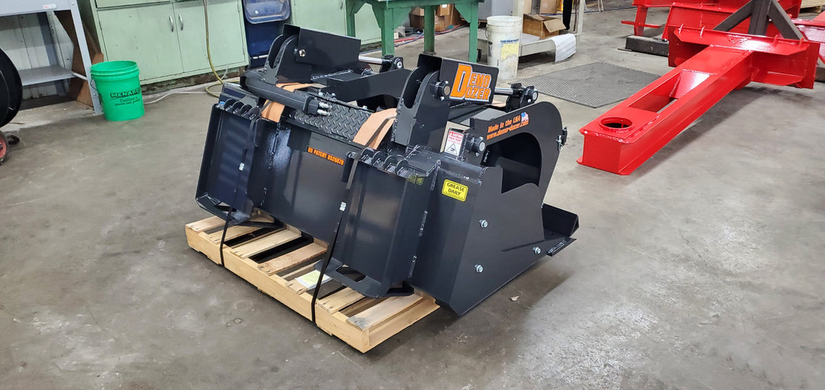Demo Dozer grapple bucket rear view showing universal skid steer quick attach; color may vary