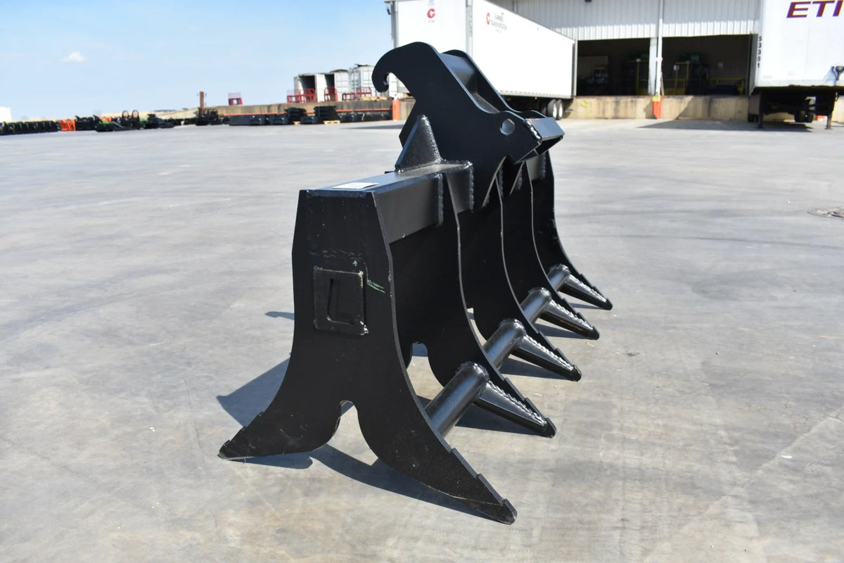 Loflin Fabrication double-sided root rake for mini excavators; manufacturer family image.