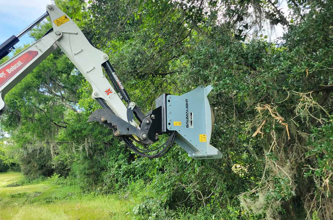 Baumalight CXC530 rotary brush cutter carrier and attachment setup